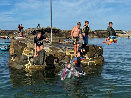 children pier jumping